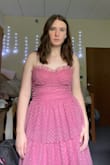This dress is so freaking cute and I love it! It fits perfectly (going in between small and medium and I went with the medium) and there were a couple of reviews that mentioned the straps loosening with movement so I sewed them in place. I'm glad I love it because I was a little worried that it would make me look like a frilly cupcake, but I feel like a princess and it's the perfect dress for graduation. - Ana L.