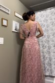 It's pretty, has soft fabric and fits spring theme. This dress is quite a bit loose around the bust for me. I'll need breast tape to keep everything looking classy and the hems in place to prevent any flashing. Zipper is a little cheap, but overall very beautiful dress for the price - Kenna M.