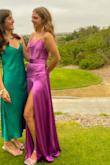 I loved this dress, the color, and the top especially, and it fits great. However, the bottom is really heavy and looks heavy too. I got the dress altered to have the slit opened about 2 inches up which helped it look less heavy and was only $15 at my local dry cleaner. After this, it looked more like the picture because I think the model is sticking her leg out to have the slit appear higher:/ - Cassidy C.