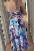 This dress is very flattering & comfortable. Fits as expected, and I love the length!! The material is light and breathable. Very excited to wear it to a summer wedding. - Madeline G.