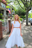 I bought this dress for an upcoming vacation to Italy but also used it for a recent mini photoshoot! It fits beautifully, I have wide hips and this skirt hid them so well. The skirt isn't heavy and flows a lot while walking. I am comfortable and can wear this all day long. Super flattering, you won't regret ordering this! I hardly write reviews but felt compelled to do so for anyone else who also still might be on the fence! - Jacqueline P.
