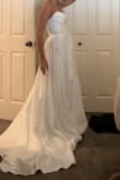 I had a nightmare with my seamstress who ruined my dress. Getting married in just a few months and this dress is a dream, I actually like it more than my original!! There was only an 8 available, I normally wear a 4 or a 6, and it's just slightly too big so I would say it runs just a little small. So worth the money, it feels like all the designer dresses I had tried on. 10/10. I will say the slit is a little high but I'm having it sewn a little. - Madison G.