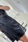 I usually wear a small, but needed more room in the bust. Medium is perfect for 38" (34D) bust. Dress is not too short. Sequins are layered well (thick) and feels like quality sewing on of sequins and construction of the dress. Color is dark blue just like those Swiftie Midnights! - Deborah R.
