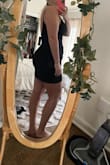 I got an xl and a l. I ended up with the L. The XL was a little loose and the L was on the tighter side but it looked really slimming and I was able to go braless which never happens. The material doesn't have give but i prefer that in this dress. The tie covers up the lower stomach while showing off the curves! The length was a bit shorter on the L but not too short that i cant wear it out. So for a night out dress it is perfect length. So it's true to size but if you want it a little tighter try a size down. 
I have it in pink and black but might get the white too! - Stephanie S.