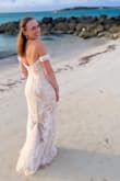 I wore this to my 10-year vow renewal on the beach at the Bahamas. 

There were 3 layers to the dress; the beading on the top was high quality and sparkled in person, the second layer had beautiful embroidery, and the bottom layer is definitely cream and not white. 

For my body type the top was very large, so I had it taken in and had cups added. I also had it shortened and added a bustle.  The hip area fit more like a size 2. The arm straps were constricting because the fabric has little give. I wore 4 inch platform shoes. 

Fabulous quality for the price confirmed by my seamstress and the compliments on the day and on photos. 

Suggest to size up and get it fitted to your body - Samantha B.