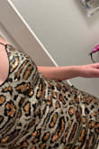 It's cute but definitely runs small and is pretty short. It kinda rides up. Typically I get Mediums but I ordered a large and feel like I needed an XL. Not as sparkly as I was hoping but not itchy or anything over comfortable in that sense. - McChrista B.