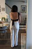Cute top. Material is thick and seems like good quality. I had to pull the tag off cause it kept rolling and exposing itself. - Nicole U.