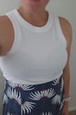 I'm really happy with this outfit and can't wait to bring it on our upcoming cruise. The material is light and very comfortable. The skirt is a little long but works well with a platform or wedge sandals. It's very flattering. The skirt also has a bit of elastic in the back and a zipper on the side so you can choose how much midriff you want to show and it stays in place. The quality is nice and I like that I can also pair it with a white tank top for another outfit option. - Marissa B.