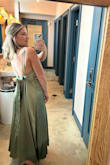 I love the color and details of this dress. I received several compliments! Unfortunately the dress wrinkles quite easily and shows/holds onto any water that touches the dress (so, not ideal for a rainy wedding day!) Some have commented on the bow thankfully my bff who tied it for me is a surgeon so that bad boy stayed put all night. With a good tight tie, you'll be good to go. - Sydney P.