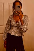 I recently purchased a back open top, and I am absolutely thrilled with my purchase. This top has quickly become one of my favorite pieces in my wardrobe. The design and style of the clothing item were modern and versatile. - Bana Z.