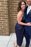 This dress is Amazing!! I'm a new mom and learning how to fit/dress my new curvy body. I'm wearing a size medium. My measurements are 40in hips, 31in waist, and 34D bust. I got so many compliments on this dress when I wore it to a wedding. Perfect cocktail attire! I love the front as it hid my mom pooch so well! The strap is adjustable which was great since my hips are bigger than bust and needed to adjust. It's satin material so took a while to steam and iron but I'm overly weird about wrinkles, hate them so much. But worth taking the time. I wore a strapless one-piece Spanx to smooth everything out and to lay better on my body. I love the navy blue color. I wore with gold jewelry but would look good with pearls and silver jewelry as well. I read just about every review on this dress before buying which was helpful and reassuring. If you're on the fence about purchasing, you won't regret it!!! - Angela M.