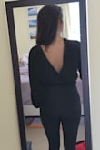 Cute, is reversible but looks a little silly in the front when worn with the slit in the back. Sleeves are about an inch or two too short. Smells atrocious when you buy it but whatever. - Ro M.