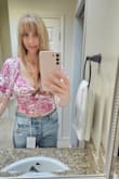 The top is super cute, flattering, feminine, easy to wear, and made of great quality. Love the color, sleeves, and tie in the back. It has a side zipper which makes it easier to put on and take off. It's a special piece. **Note** Pix will show me wearing it but I ordered it for my 21 yr old daughter for a bachelorette event. - AMBER K.