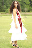 This dress was beautiful. I ordered it for graduation photos, but this could be dressed up with heels or down with flats. The material is high quality and does not stretch. I did not need to wear a bra with this dress either. I loved it! - Isabella B.