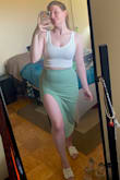 I first ordered this in pink and it just wasn't for me. The color was awesome but I'm just not that girl. I reordered in Sage and I LOVE IT! I ordered size M and I'd say it fits me as I expected it to. Both pieces are super flattering, I did have to buy some boob tape for the top for when I do wear this out, I'm personally not a fan of strapless bras. It will look great dressed up as the set or dressed down a little with a different top! The skirt does need to be steamed or ironed since it's folded, it does arrive wrinkled. I did roll the top of the band twice to get the slit to sit nicer on my leg, but if you're taller that probably isn't necessary. - Alexis C.