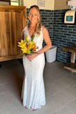 I bought this for my husband and I's beach vow renewal in May '23.  It fits perfectly and looks great.  I bought the sephoraa ivory lace pearl pointed toe mule pumps to match which are more white than ivory.  Works great with the dress.  I did have to have the bottom hemmed up because I am short. I wore it the same night on the cruise ship for formal night and got tons of compliments. - Michele D.