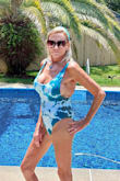 The first time I wore this swimsuit I received so many compliments on how nice it looked on me.  It fits perfectly with enough sexiness that I'm very comfortable wearing it. I don't feel like I look 64 years old while wearing this suit! - Pam J.