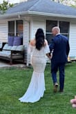 I got this dress for my micro wedding, and it perfectly embodies the rustic boho theme I was aiming for. I was pleasantly surprised that I didn't require any shapewear or worry about visible undergarments. To ensure a seamless look, I opted for nude undergarments. The train of the dress is absolutely dreamy. I should note that it might be a tad too long if you plan on dancing throughout the night. A simple solution would be to have a tailor add a button to hook it up when needed. I found the dress to be comfortable throughout the entire event, it was compliments all night long. It truly is the wedding dress for me. Thank you Lulus. - Wai L.