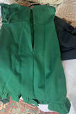 The dress is a beautiful color, the material is thick but feels well-made. The fit is great and is quite flattering. 
My disappointment was in the quality control. There is a "crease" that runs down the back of the dress a couple of inches away from the zipper. The problem is that when it's on it shows that the material is a darker color of green down the entire length of the dress. So the crease doesn't ever go away it stays even when stretched out and looks like someone took a marker and drew a dark green line the entire way down the back. My event is too close to try and return it but still unsure if I will wear it with that running down the back. - Shauna W.