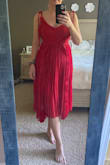 This dress is very pretty and soft. It hits just below the knee with an embellishment at the waist that allows for a strip of semi-see-through action. The neckline is a bit higher than seems to be represented in the product images, although that may have something to do with my bust. The straps tie at the shoulders, which I don't love because it's hard to get them even by yourself. The material gives it lots of motion and allows for maximum comfort! I could see myself wearing this dress to a formal occasion. Unfortunately, I don't have any coming up so I sent this beauty back. - Sarah W.