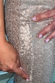 Low quality. The dress arrived damaged. - Ana I.