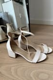 I have bought the heels for my wedding. I love how simple, comfortable and true to size they are, not sure if it's just me but they appear a bit more yellowish IRL than on the picture and have come with black spots on the back (could remove them with water). I will probably look for another pair of shoes and have these for the party and other occasions :) - Anja B.