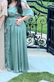 Bought this dress to wear to a formal spring wedding & got so many compliments! I am 10 weeks postpartum & it just barely fit me in the bust. The snap on the bust would not stay closed so I had my alterations add a hook & clasp there instead & it worked perfectly to keep in my chest! It is very long so I had to get it hemmed for sure! Unsure of my bra size since having a baby so I did not wear one with the dress but still felt very supported. It's very easy to move in & flowy! - Kimberly Q.