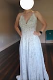 I purchased this dress after trying 6 others from Lulus. The dress is beautiful and the fit was almost perfect! It is very comfortable and lightweight.
There were a few things that I wasn't thrilled about with the fit. The straps were too long (and not adjustable) and the dress was very long.
I have a long torso so clasping the bodysuit was also a bit of a struggle. I bought the dress with the intention of replacing the bodysuit with a lining so it ultimately wasn't a problem.
I ended up getting the dress altered by shortening the straps, lining the skirt of the dress with a matching nude lining, and closing up the slit. I also had the front hemmed and left the back as is, turning it into a train.
The dress was perfect after the alterations but still beautiful without them. I've included a photo of the dress before the alterations and one afterward. - Saray F.