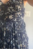 This dress is absolutely beautiful. I had been eyeing it for a long time for a May rooftop wedding and finally pulled the trigger. It was just as beautiful as pictured when I pulled it out of the bag. Sadly, when I put it on, the fabric around the zipper was a mess. The pleats around the zipper were uneven and not pressed, did not lay flat, and were noticeably bulgy. I love Lulus but the quality of the dresses do not match the price. Sadly I didn't have a backup dress to wear or I would have returned it - Cortney W.
