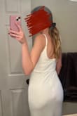 This fabric feels thick but still shows your stomach, and any prominent bones. Also the zipper down the back stops in a very unflattering spot on the butt. Don't really have anything good to say about this dress - Annika H.