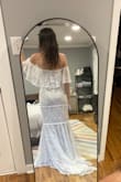 I really loved this dress, but in the end, I chose a slightly simpler one from Lulus with less of a train. I didn't want to trip over the train, and I was worried the off-the-shoulder part could potentially look weird in pictures, but I WISH I could just own this to wear for something else. So elegant and beautiful. - Allison G.