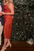 Wore this dress several months ago for a wedding (pictured). At the time I weighed about 160. I should have probably sized down to a M. There was lots of extra room under the arms because of my small chest. - Hannah L.