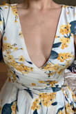 I'm so disappointed that I didn't read the reviews before purchasing. It's very tight up top and it drops way too low. This was supposed to be for my brother's wedding and I thought it would be very flattering and classy. Nope. Now I'm rushing around looking for a new dress to wear! The model dress is very misleading. I can't even sew a clasp there because then it's super tight. - Crystal D.