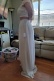 I was nervous at first but took a chance. The dress was delivered in 2 days. The quality was a pleasant surprise. I had to have the dress altered to fit my body, but I'm quite happy with my purchase. The dress was larger than expected. Alterations are not complete yet, but my seamstress said it will be an easy job and nice material to work with. My only wish is that I could get a flower girl dress from here as well. - Alycia S.