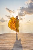 Perfect influencer vacation dress! (>p This dress is much heftier, higher quality than a lot of my Lulu dresses. It flows with the wind so beautifully. It captures so well! The movement, the color, the fitting! The best golden hour dress. Wore it in Maldives and Belize. It may feel loose on the chest part but with strap adjustment it fits well. Size 34b, size 26 pants, size 4 dress. Got it XS. It fit me best when I weighed about 124 lbs. It still fit me when I gained weight-135 lbs. I want this dress in red!!! More photos on my insta if you're interested @momnicat - Monica C.