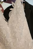 This dress worked beautifully for an outdoor wedding with its leafy embroidery design. Although I preferred the Fairytale Love Story Off Shoulder dress for its delicate flower tulle and design, I didn't have time to alter or exchange sizes. So...this was the one as it was versatile because of the lace-up back and the bottom was easy to hem with the plain tulle. Also, no issues with the top being too large if you have a small bust. No pads or bras needed. Overall, very happy. - Christina S.