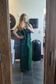 It was very difficult to find a black-tie-wedding appropriate dress that fit my curvy postpartum body, and this was exactly what I needed. Accommodates a large bust without excessive cleavage, and forgiving of a tummy without being frumpy. The color is beautiful, and the sort of glitter that does not get everywhere. Highly recommend this dress! - Breanna J.