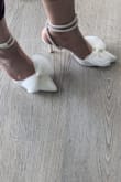I loved the shoes in the pictures, so bought them for my wedding (will definitely have backup sneakers for when my feet get tired). Tried them on one time. they looked good and seemed comfortable. It was a little difficult to get the straps correct since there were no instructions, however, I got it in a few tries. Overall, I'm happy with the purchase, however, the true test will be on the wedding day. - Pixy G.