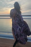 I wore this dress on a cruise and it looked stunning. It was flowy and felt comfortable. I bought the xs when I needed a small but I adjusted the back with a string and it still fit beautifully! The neckline looked elegant as well. - Lucinda D.
