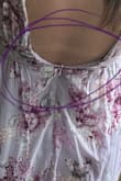 I adore this dress but can't zip whole way when get to boob area. Hoping I can get it taken out a tad - Zia H.
