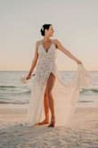 I bought 2 dresses from Lulus and both were beautiful.  It came down to the last hour and when I saw the beach that day I knew this was the dress.  I could feel it on but it wasn't heavy.  The lacework is beautiful.  I didn't have time to get it hemmed but it works for the beach and 2" inch heels for the reception.  If I had time to I would have closed up an inch or 2 of the slit.  Great dress to photograph in. - Steph W.
