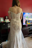 This dress fit like a glove. It did not require any alterations with high heals. 

If you are looking of an elegant dress, this is your dress! - Julia B.