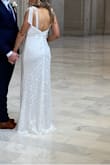 I wore this dress for our simple city hall wedding. Loved the fit and it turned out great in pictures. The dress was long on me even with 3 inch heels. Wouldn't want the slit to be any higher in the front. Super comfortable and easy to wear. The tie straps make the dress easy to adjust for a customizable fit. - Shelby R.