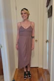 So the fabric doesn't stretch at all, so keep this in mind- my boobs were squeezed in pretty tight. For me, it looked way better with heels as well than without. Overall, I loved this dress. I got so many compliments at the wedding, and tons after on my pictures. It fit the romantic wedding vibe, but was so easy to dance in at the reception. I loved it! - Jenna S.
