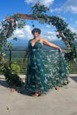 I wore this to a June Wedding in Tennessee. It fit great and was a confidence booster since it did not cling to me. I had a friend shorten the length and close up the slit just a bit because I don't wear high heels really. The best part was dancing the night away with the tulle part. - Reyna S.