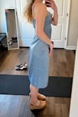 Color is definitely more dusty blue than the bright luminescent blue as depicted. Fit is fine, just didn't keep because I felt like it just didn't do anything for my legs. The slit is minimal unless you're standing with a pretty broad stance. - Katie B.