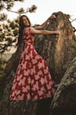 I wore this dress for my engagement photos in Colorado and it was absolutely stunning! The wrap dress aspect makes it easy to adjust the sizing as needed, which is good for me since I have a smaller waist and more athletic hips and legs. I've gotten so many compliments every time I wear this dress. Highly recommend. The material is light weight and flowy. I did also order this dress in white and found that it was slightly see-through. - Jessica B.