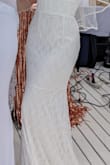I bought this dress for a party, and I didn't expect that for the price the fabric would be so spectacular and the fit so perfect. Simple yet chic, the dress has been praised by absolutely everyone. Given my height, it was a bit long on me and I occasionally stepped on it, but nothing serious and it gave a nice shape to the drape. Highly recommend! I would re-wed just to wear this dress seriously (it was even nicer than the one I actually wore to my wedding a few years ago). - Ariana S.