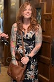 This dress is a bit tight on me in the torso, as in, it's an event to get into but once it's zipped it's gorgeous and comfortable. I don't have much bust but I do lift, so if in doubt on your lats or ribcage, I'd size up one. Straps are adjustable and I love the high-low hem.
Please enjoy one posed photo and one feral, candid photo. - Nicole H.