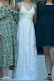 I loved this dress and the material of it was so comfortable! It was perfect for my wedding and photographed so well. I wore shoes that are about 1.5 inches and it made the dress a perfect length to just graze the floor. - Alyssa M.